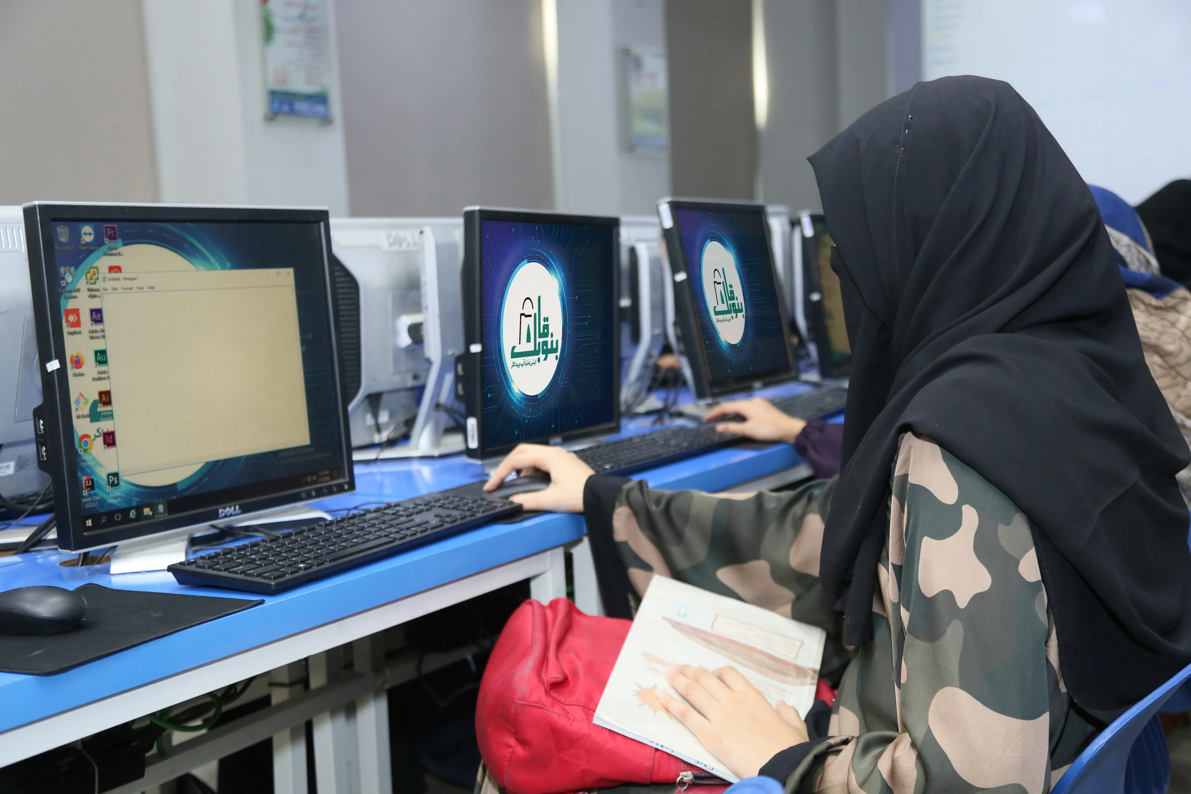 Bano Qabil volunteer distributing supplies